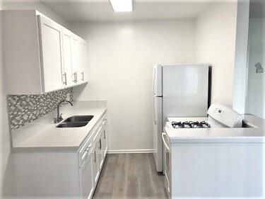 Kitchen with white appliances.